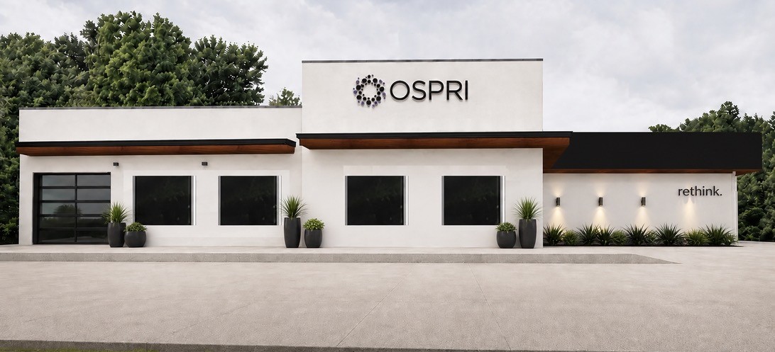 Architectural rendering of the planned OSPRI facility: a single-storey building carrying the OSPRI mark, with the word rethink on the right-hand elevation. The building is in design and is not open.